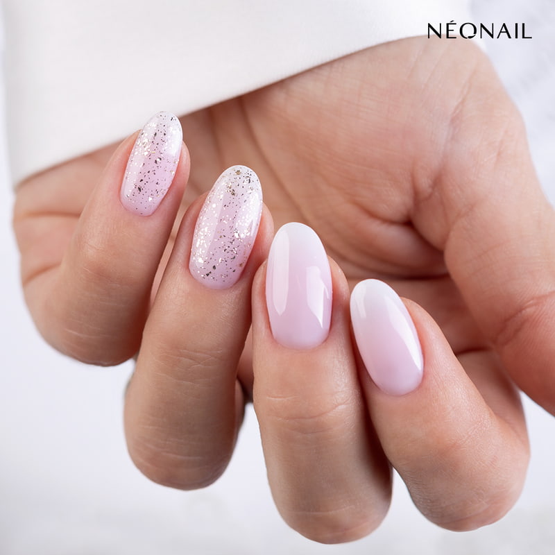 Light pink nails with golden flakes
